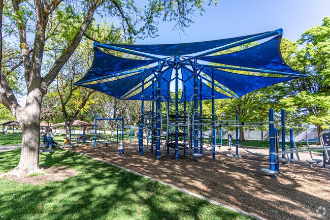Westmore Park includes a tree-shaded playground near the elementary school.
