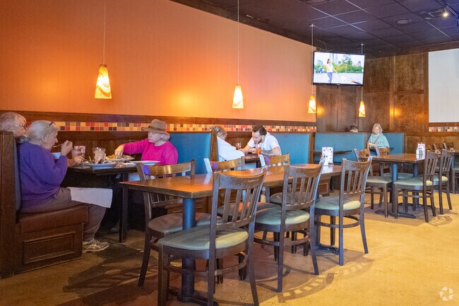 People enjoying a delicious meal at Sixty Six in Oak Garden.