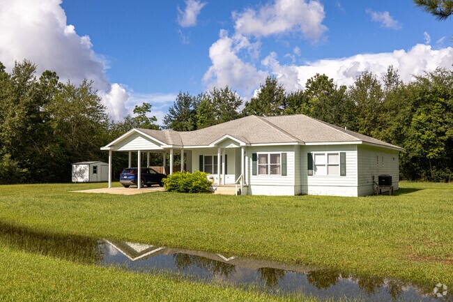 A Wewahitchka ranch-style residence with attached garage, priced for budget-conscious buyers.