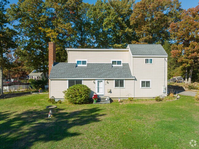Large two story wood frame homes are in Assonet Bay.