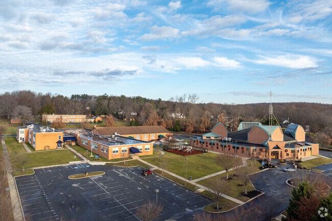 Holy Angels campus is beautiful with large brick buildings.