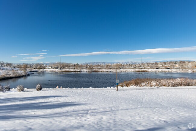 Hillcrest neighbors stroll by Webster Lake at E.B. Rains Jr. Memorial Park.