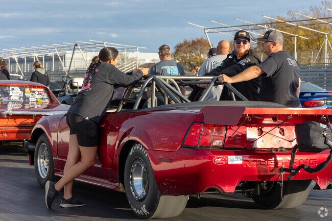 Cars line up to test their muscle on the drag strip at Tulsa Raceway Park.