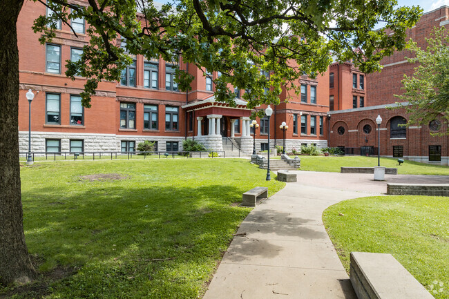 Shaded by large trees, students walk a picturesque campus at Central High School.
