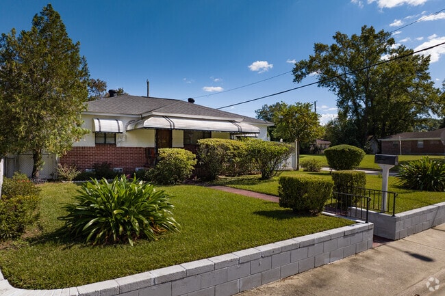 Tropical landscaping can be found on many lawns in front of homes in Carver Heights.