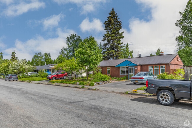 Airport Heights is home to many ranch-style homes surrounded by lush greenery and trees.