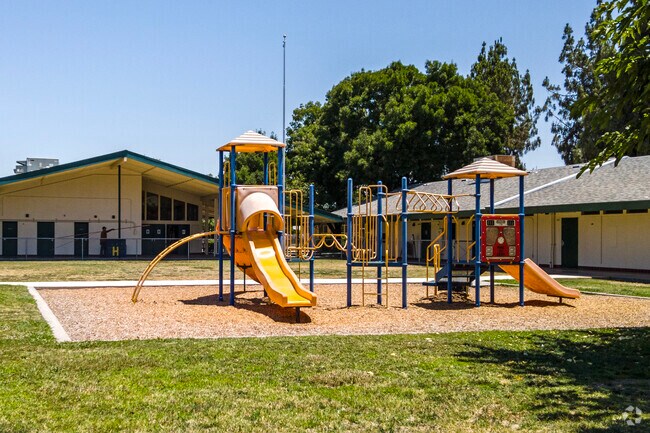 Students enjoy the multiple playgrounds at Holland Elementary School in Fresno.