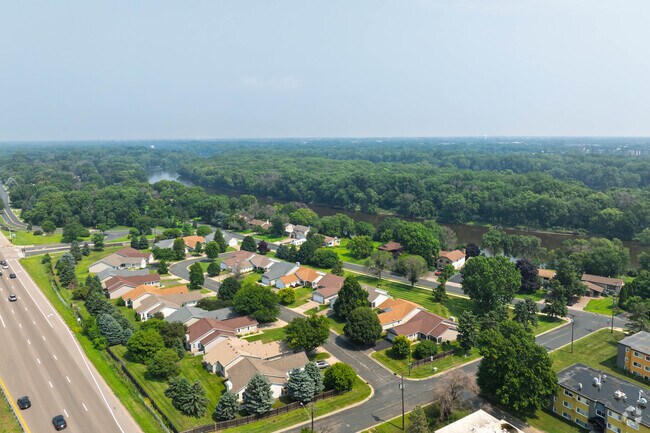 Newer construction occupies southern sections of Riverwood, complementing the established ranch and split-level homes that define this riverside Brooklyn Center neighborhood's character.