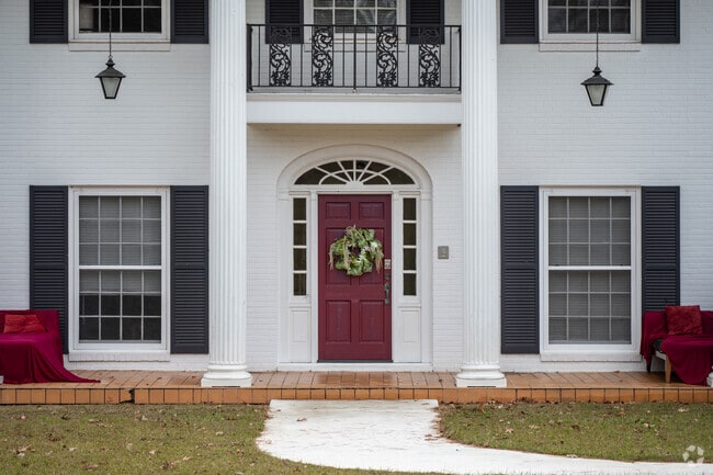 The stately columns and second floor balcony of this colonial home stand out in Chattahoochee.