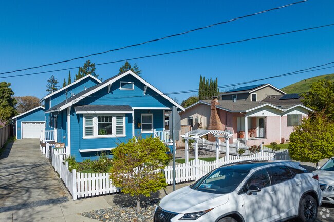 Rancher-style homes feature a single-story layout, a low-pitched roof, and an open floor plan.