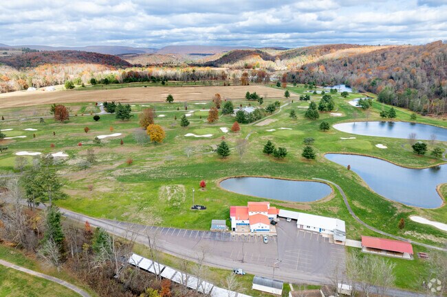 Mill Race Golf and Camping Resort near Pine Township offers public golf and lake views.