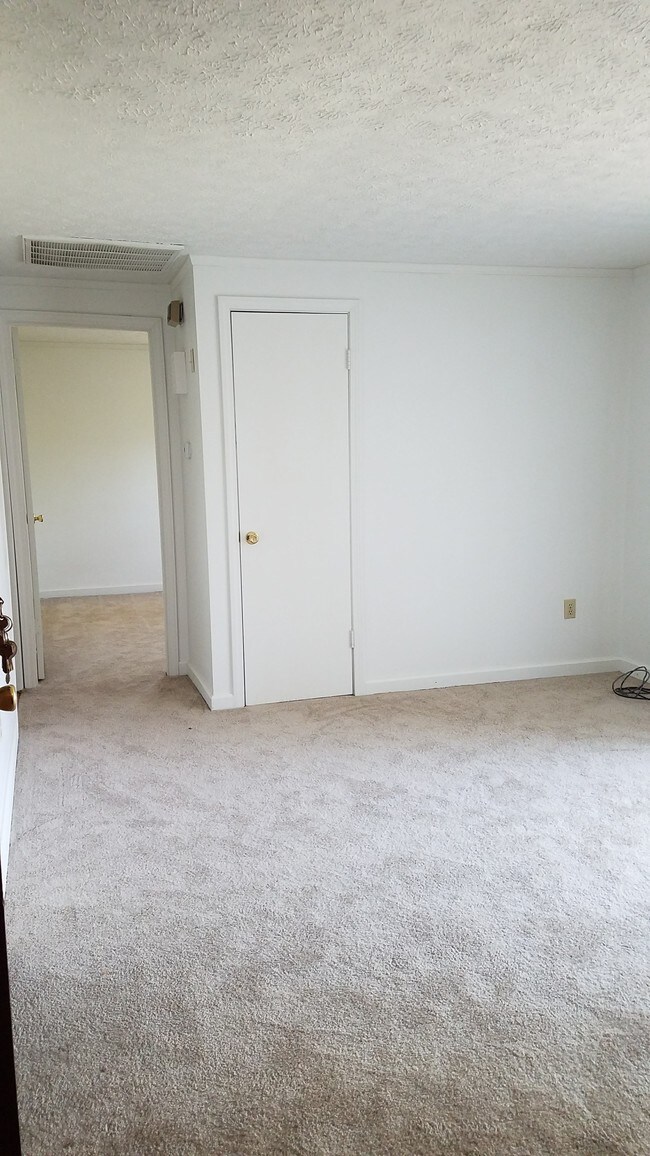 Living room looking into front bedroom