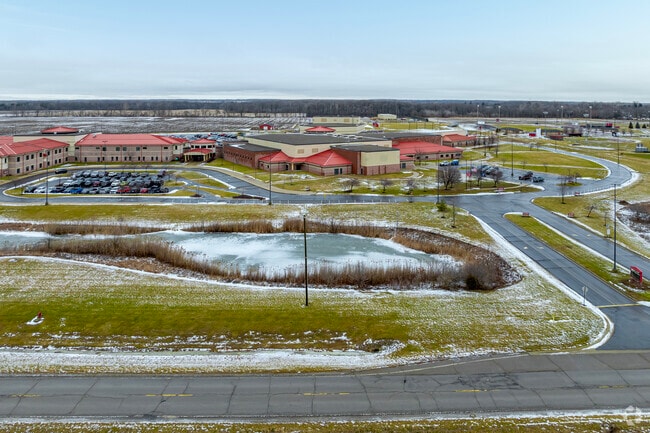 A long looping drive encircles Milan High School for pickups and drop offs.