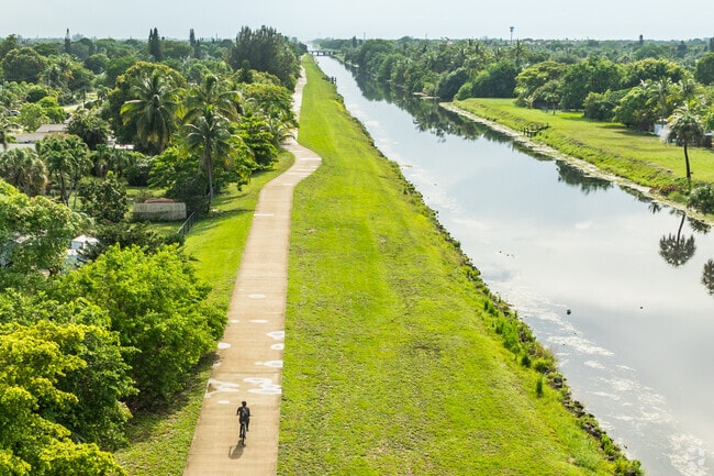 Bike along the waterways at Cypress Creek Greenway Bicycle Path in Margate, FL.