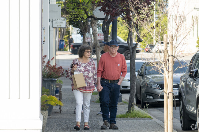 A couple walking around downtown Pacific Grove.