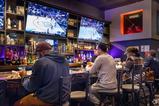 Locals grab a beer and watch the game at Xpadas Bar & Grill in Sycamore Creek.