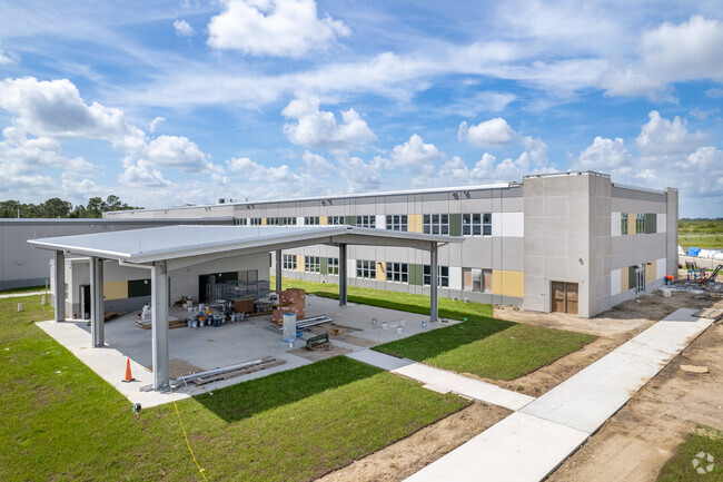 Amanecer Elementary School has covered outdoor play areas to protect from sun and rain.
