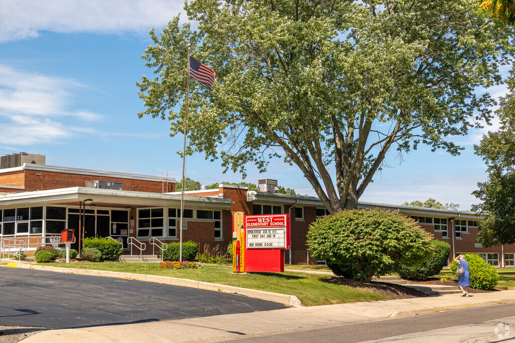 A grandmother entering the school to pick up her kids at West Elementary School in Zion, IL.