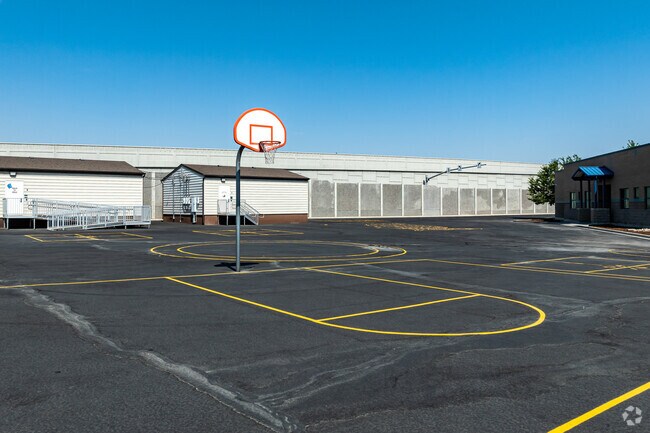 Basketball courts and other outdoor activities are located at Columbia Elementary School.