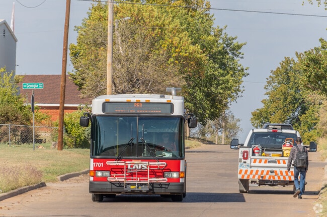 Lee Boulevard runs parallel with multiple bus stops for Lawton View, served by Lawton Transit.