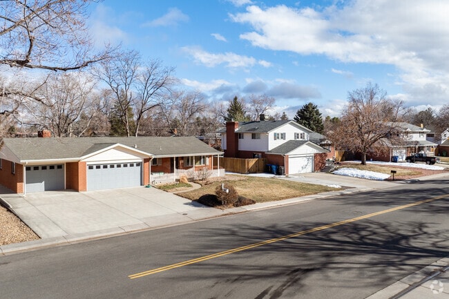 A ranch home rests beside a split level home in Oak Crest, Arvada, Colorado.