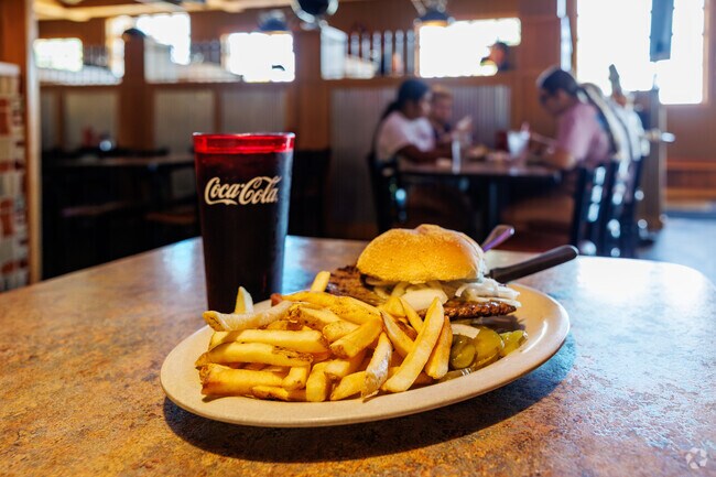 A steak sandwich with french fries from Cinder's Charcoal Grill draws Colony Oaks residents.