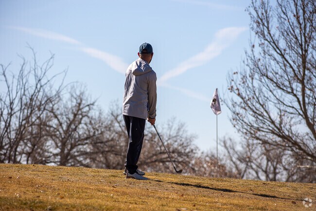 Golfers enjoy the local Arroyo Del Oso golf course in Academy West.