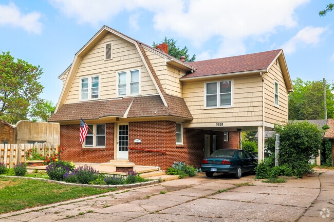 This Sleepy Hollow home has a nice, covered area for parking cars.