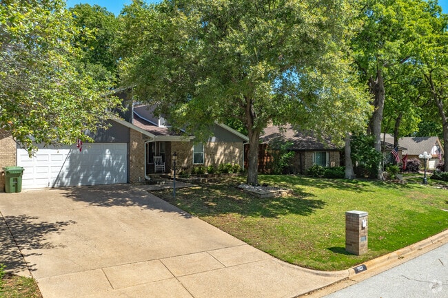 Some areas of Grapevine have older homes that are surrounded by tall mature trees.