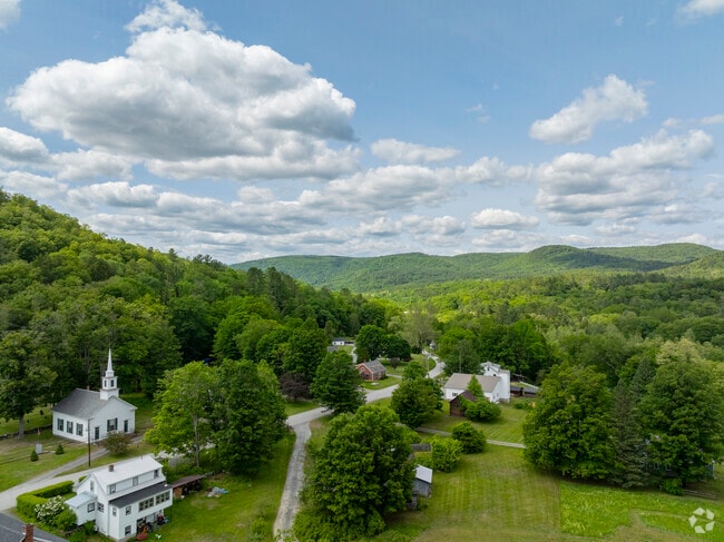 Aerial views of Dummerston highlight its peaceful landscapes dotted with homes and barns.