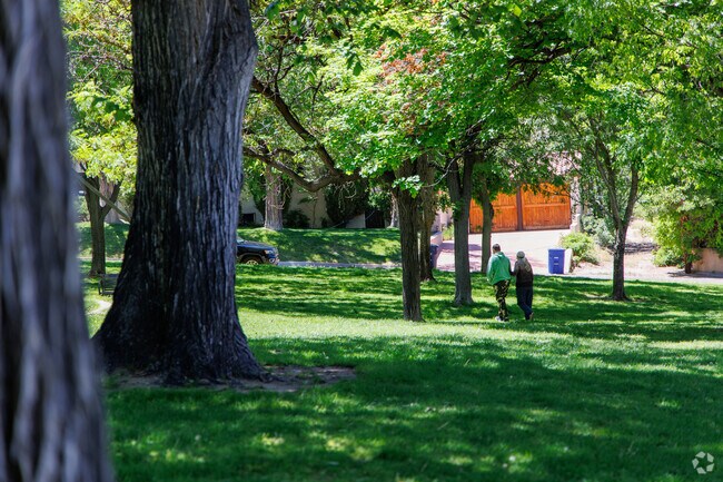 Residents enjoy a quiet stroll around Spruce Park.