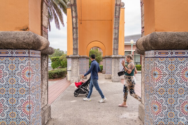 Residents walk through Opa-locka's distinct Moorish architecture.