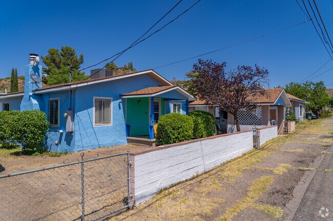 Homes in this section of Central Heights-Midland City often showcase mid-century ranch or bungalow styles, many updated with colorful exteriors and chain-link fencing.