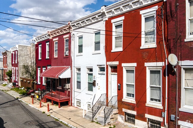 Two-story brick row homes are a common sight in the Hartranft neighborhood.