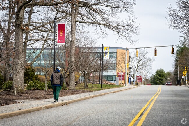A student from Rhode Island College walks through the campus situated in Providence, RI.