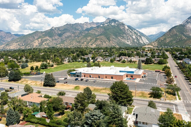 Overview of Park Lane Elementary School flanked by mountains in Sandy, UT.