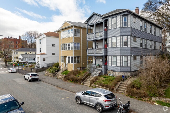 A row of multifamily homes in Hamilton have three units, some have enclosed or open porches.