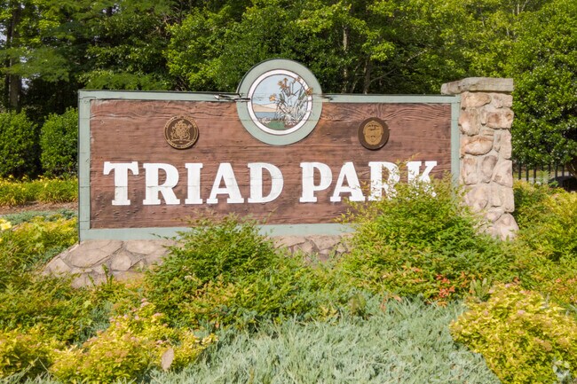Triad park sign at the entrance in Abbotts Creek
