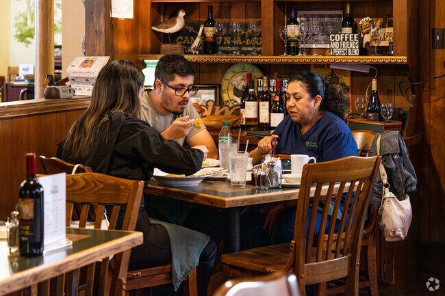 A local family enjoys a meal together at Nicole's Italian Restaurant near The Highlands.