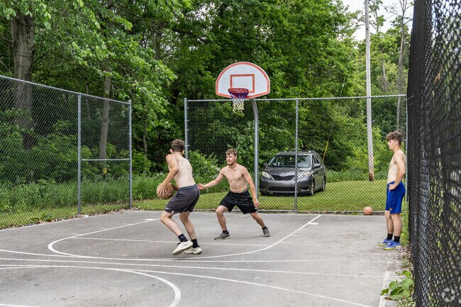 Residents meet for a game of 1 on1 at the hoops at Fairhaven Park.