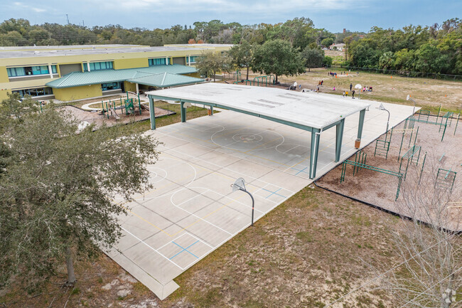 Students enjoy outdoor play on the sports courts at Tarpon Springs Elementary.
