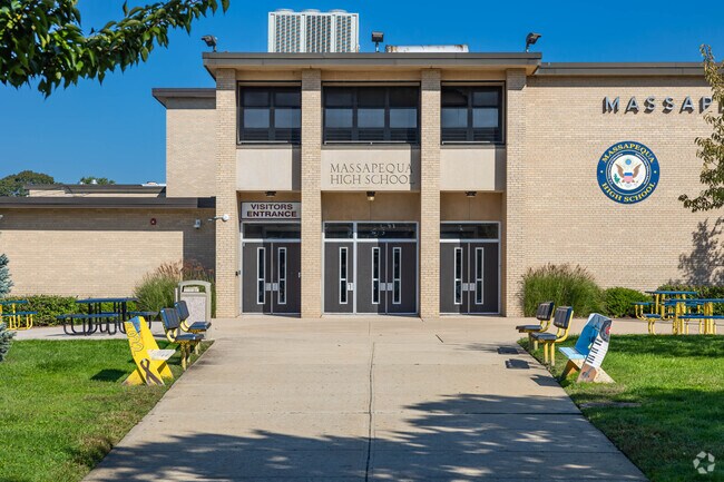 Massapequa High School in nearby Massapequa is given an A- from Niche.