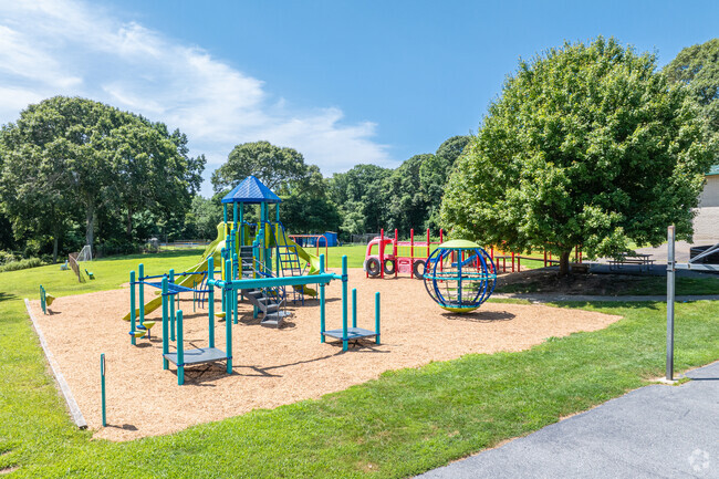 Students enjoy a well maintained play area on campus at Mile Creek School .