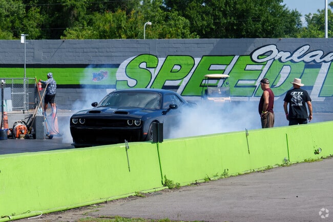 A Wedgefield resident burns rubber to warm up tires before racing at Orlando Speed World.