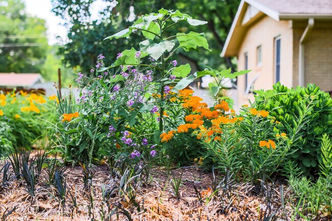 This Benjamin Hills-Pleasant Valley home has a beautiful flower bed in its front yard.