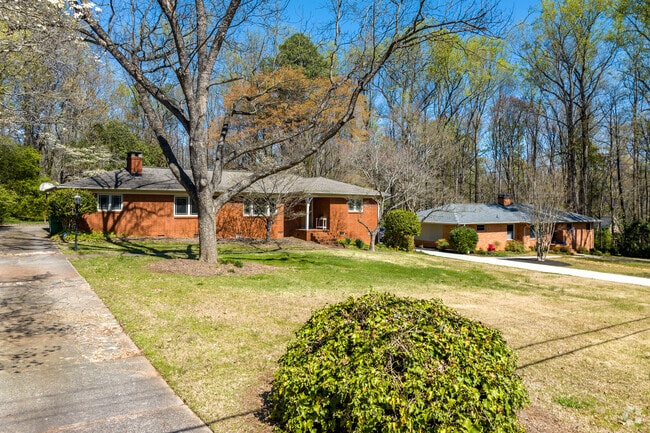 Brick, Ranch style homes typically have large yards in East Forest, North Carolina.