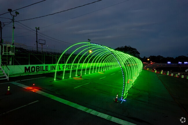 Holiday lights transform Mobile International Speedway into a festive display.