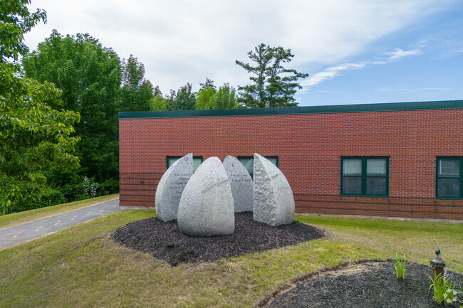 Raymond Elementary School stone sculptures.