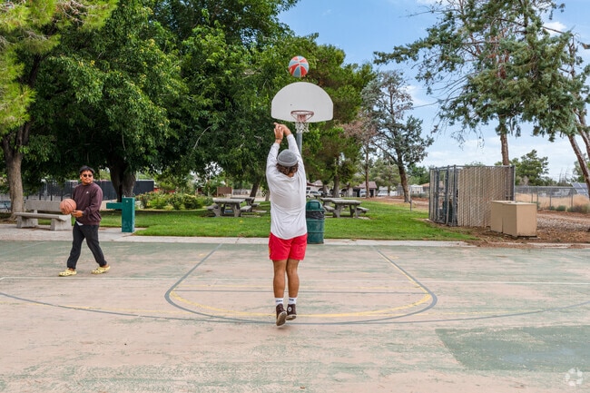 A basketball player shoots a three at Everett Martin Park in the Littlerock neighborhood.