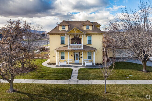 This large yellow home in Westfields North is a fusion of Colonial and Cape Cod styles.